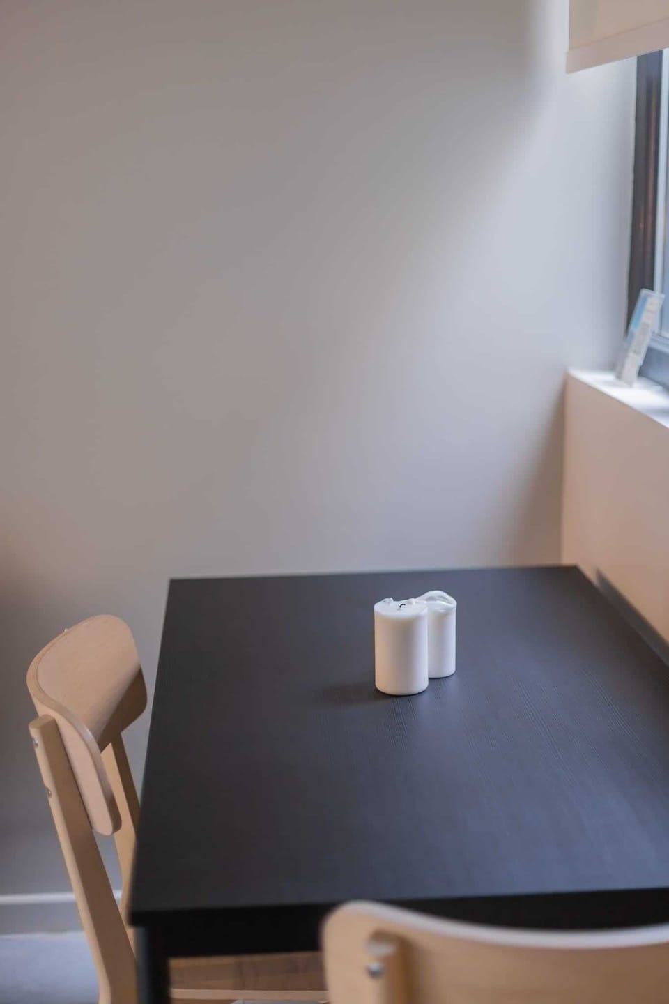 Cozy dining nook with natural light, perfect for intimate meals or morning coffee.