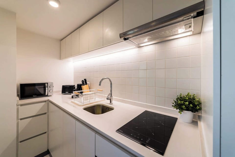 Modern and efficient kitchen with sleek appliances, perfect for preparing meals during your stay.
