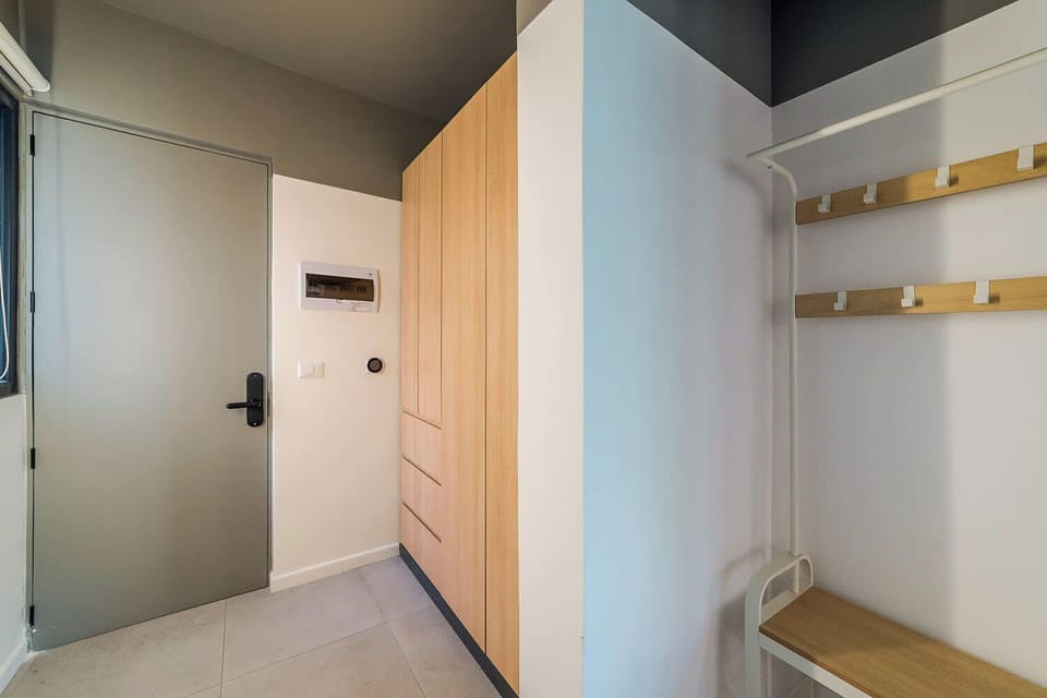 Modern entryway with ample storage and sleek design, perfect for a comfortable stay.