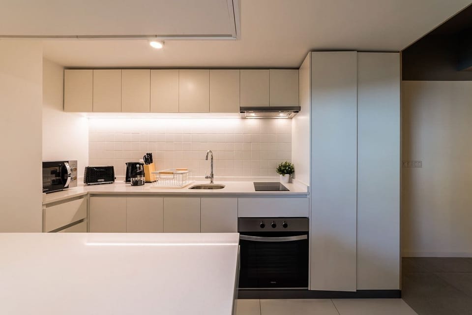 Sleek and modern kitchen with all essentials for a comfortable stay in the heart of the city.