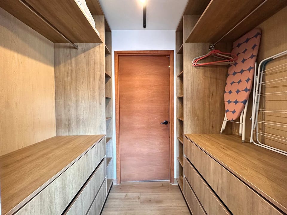 Spacious walk-in closet with ample storage, perfect for keeping your belongings organized during your stay.