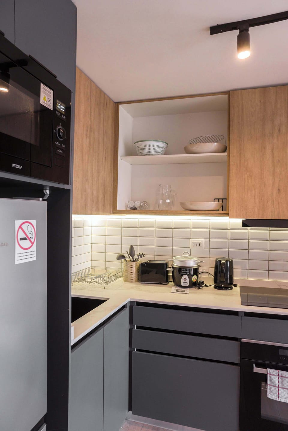 Modern and fully-equipped kitchen with sleek appliances and stylish design, perfect for preparing meals during your stay.