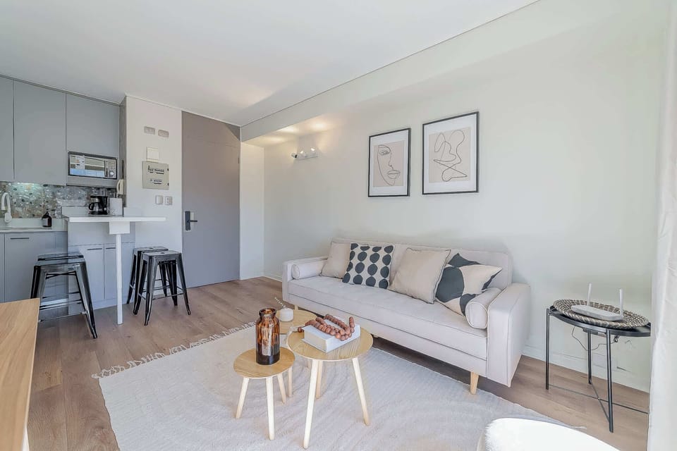 Relax in this stylish living area with modern decor and a cozy atmosphere, perfect for unwinding after exploring the city.