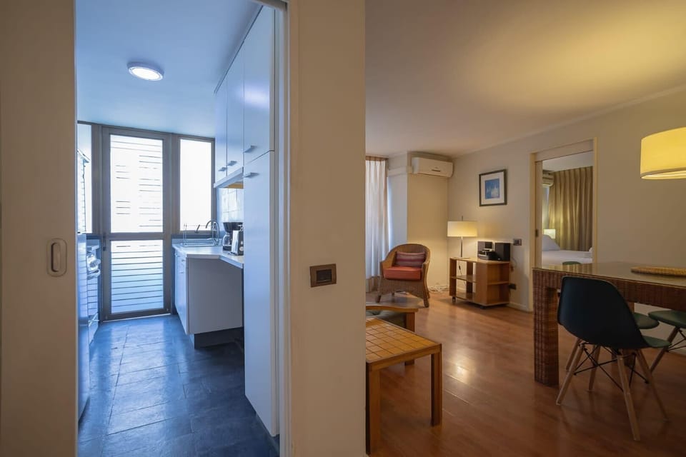 Cozy studio with a modern kitchen and inviting living space, perfect for a relaxing stay in the heart of Chile.