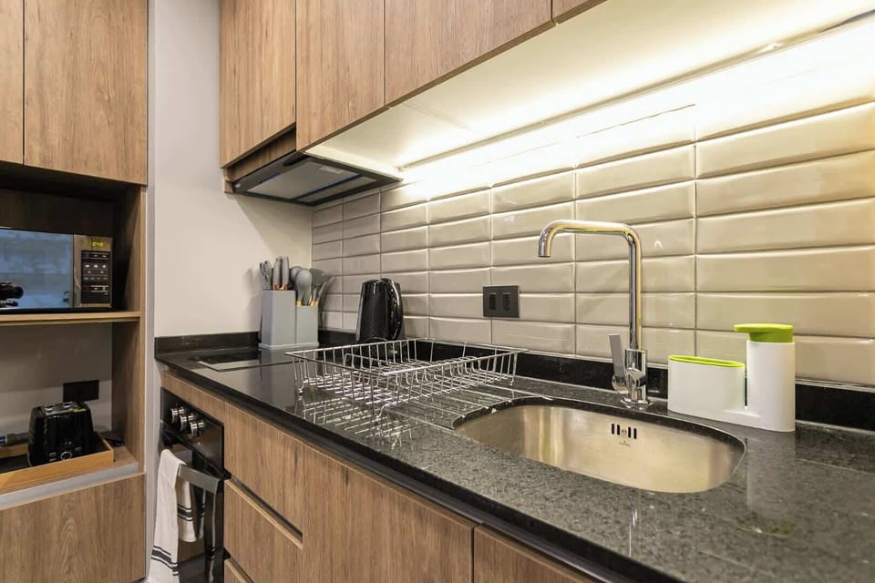 Sleek and modern kitchen with all essentials, perfect for cooking your favorite meals in style.