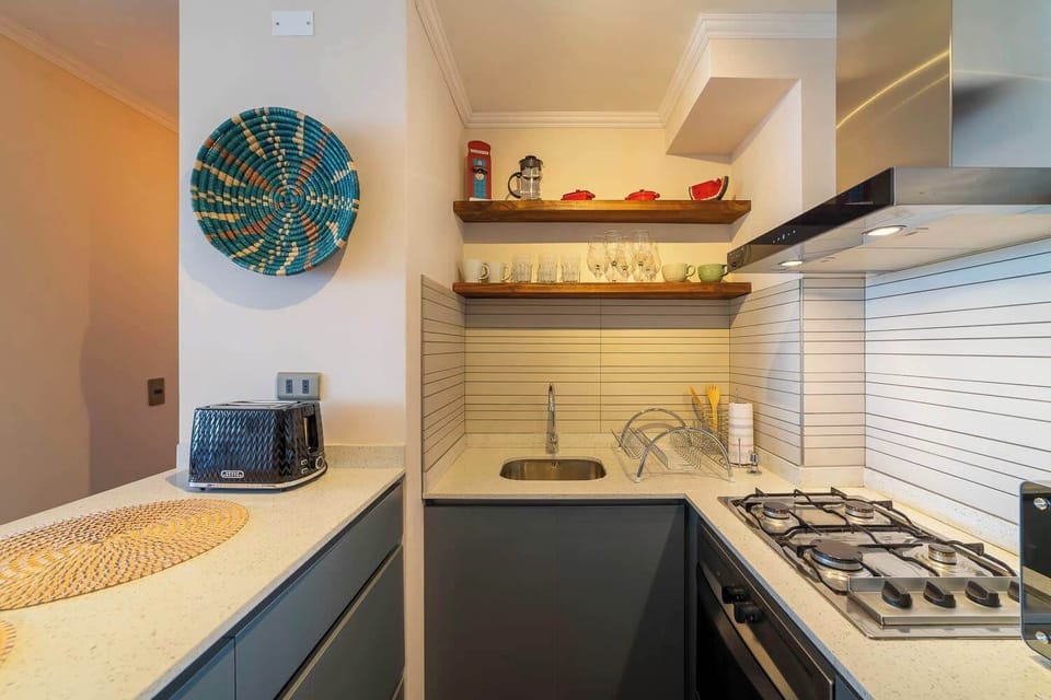 Charming and efficient kitchen with modern amenities, perfect for cooking a cozy meal in the heart of your Chilean getaway.