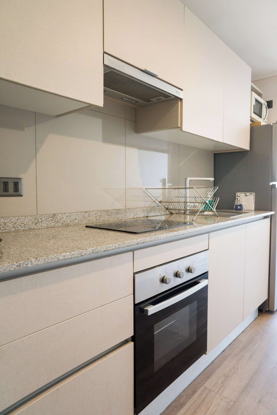 Sleek and modern kitchen with all essentials for a cozy stay in the heart of Chile.
