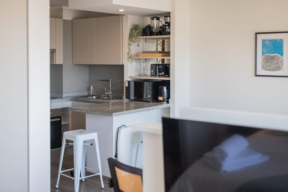 Modern kitchen with sleek appliances and ample counter space for your culinary adventures.
