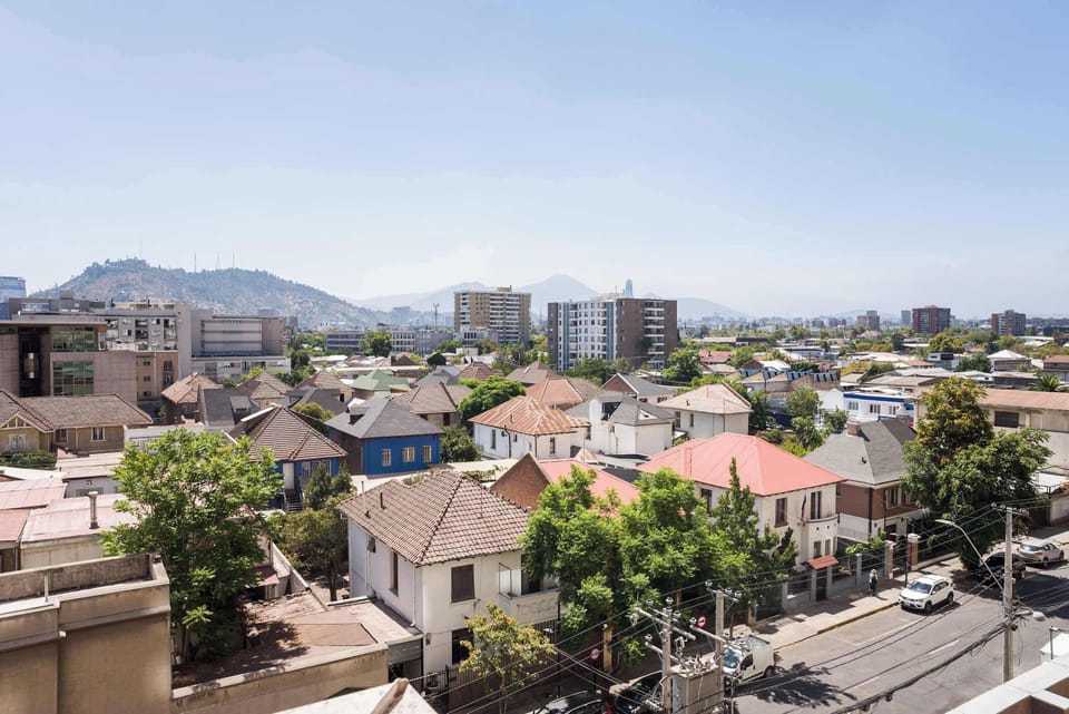 Enjoy stunning views of the vibrant cityscape and distant hills from your apartment.