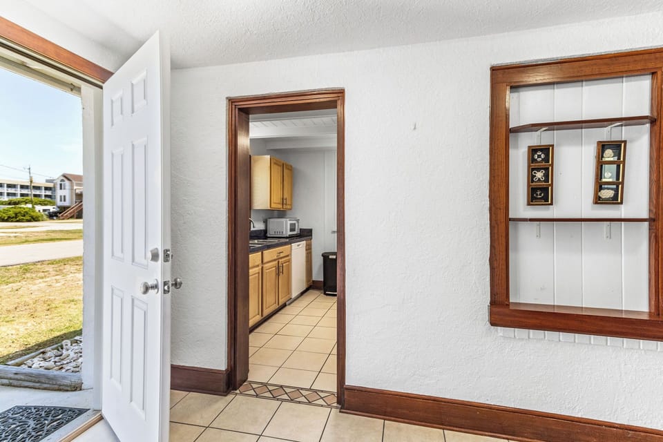 Home Entry - This entry way is spacious and functional here you can access the laundry room, bathroom and store your things.
