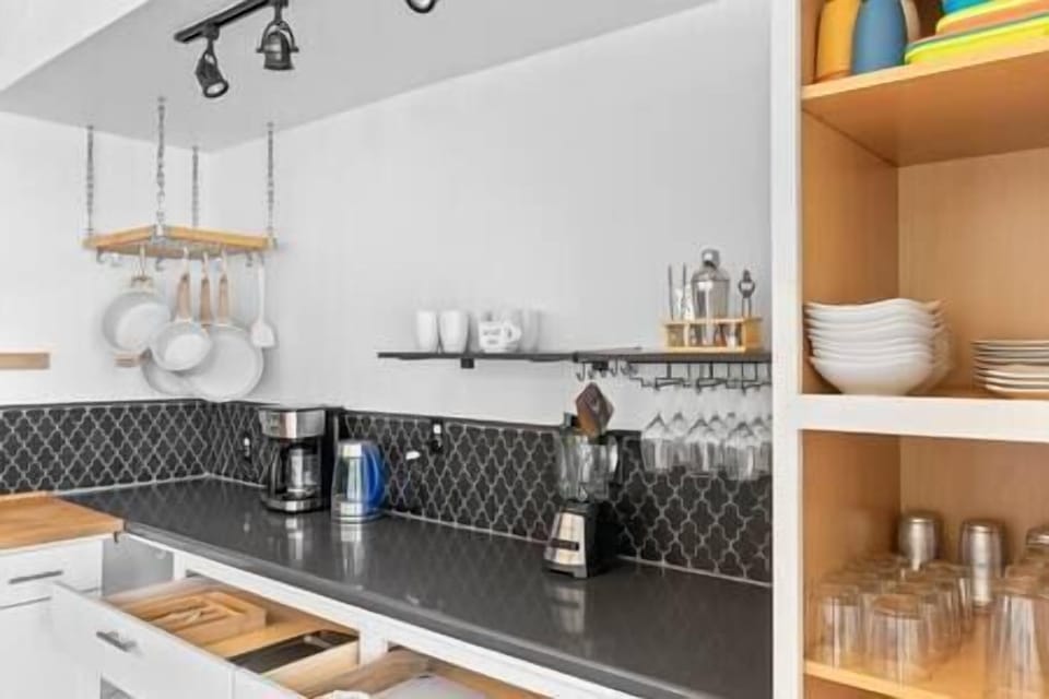 Open shelving stocked with cookware
