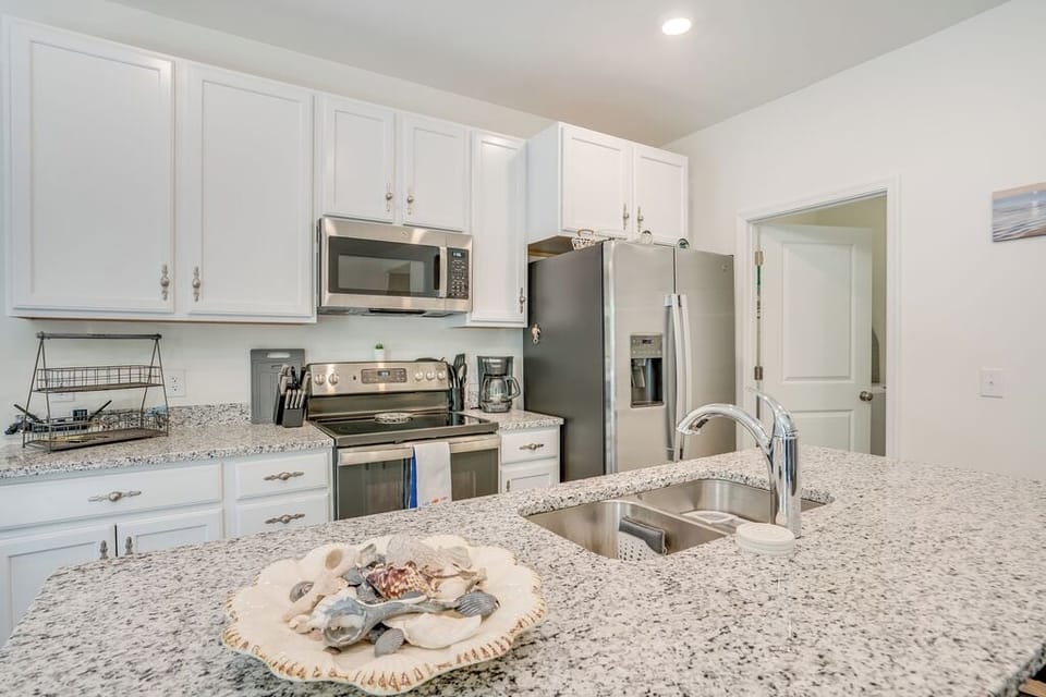 Gleaming Granite Countertops and Stainless Appliances.