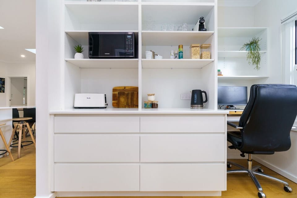 Simplify your stay with our kitchen and nearby walk-in pantry for easy access.