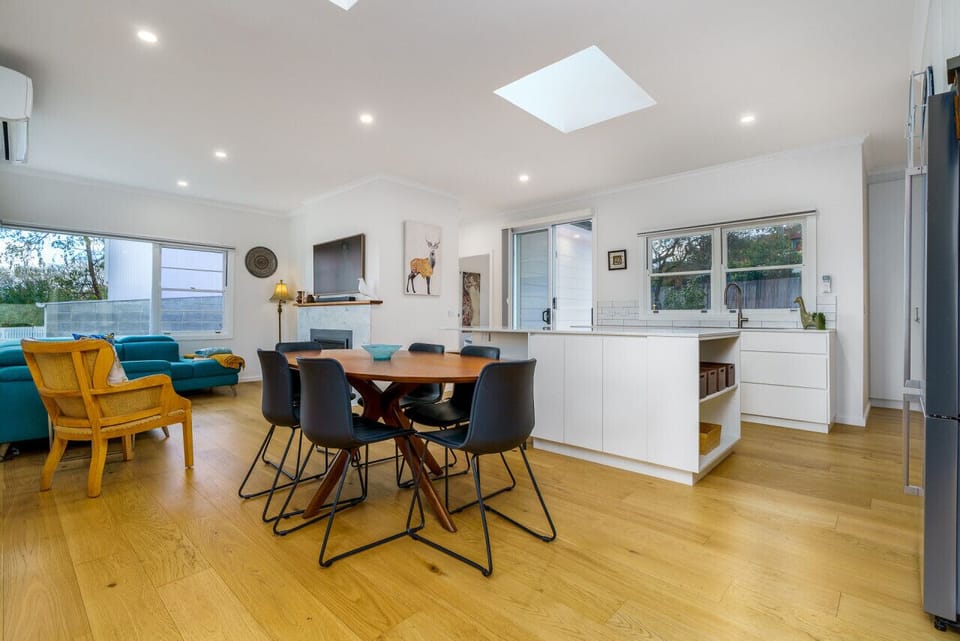 Entertain with ease in our modern open-plan dining, lounge, and kitchen area.