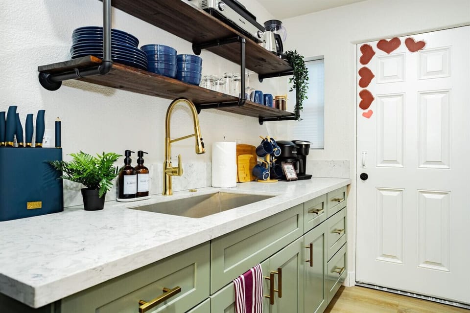 Charming Kitchen Nook: Stylish space with modern appliances and delightful decor for culinary creations!