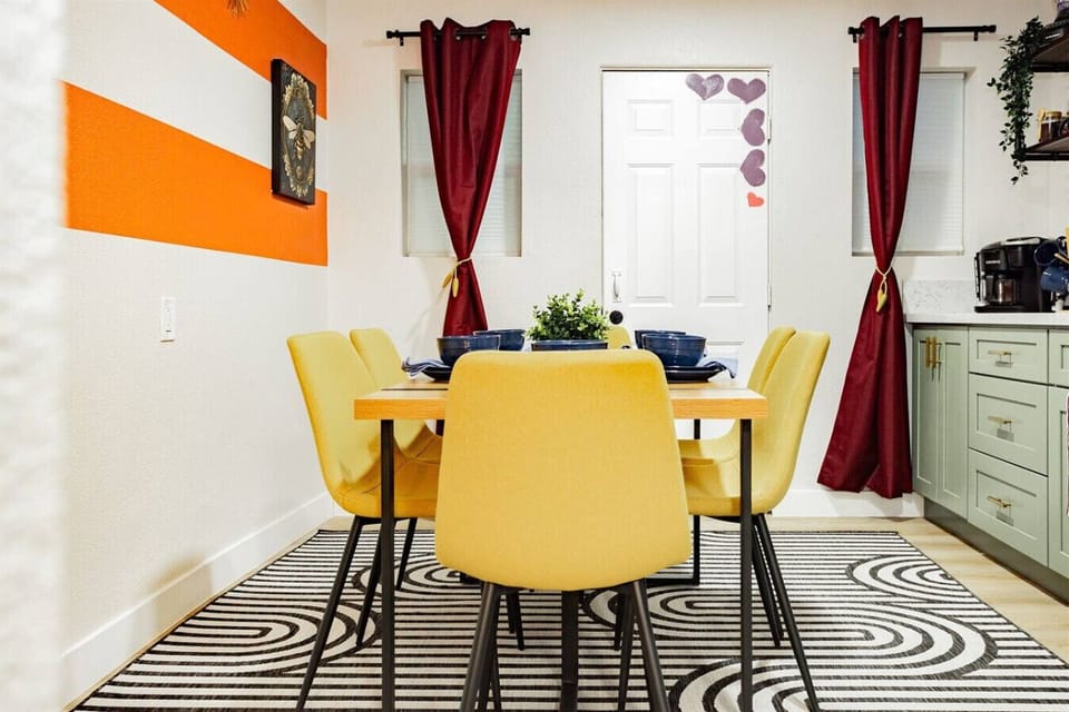 Dining Area: Cheerful yellow chairs and playful decor invite fun meals and lively conversation!
