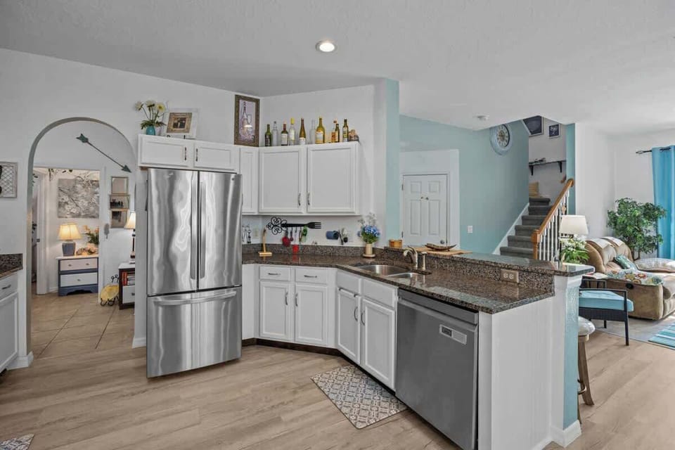 The expansiveness of the Kitchen area make it possible for more than one cook at a time.  Other photos will show the rest of the large Kitchen & more Work Space. The Pantry will appear in other photos, it is even large enough for the Trash Container.
