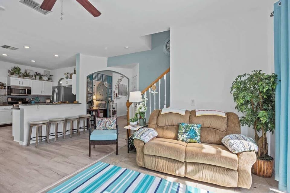 Notice the openness of the Kitchen, Garden Room; up the steps, and even into the Living Room. 
An added bonus; to the right of this room here is the entrance to the pool.  Your family can still be together but yet in different areas. How fun is that?