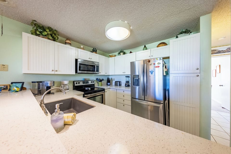 Fully equipped kitchen with modern appliances and bar seating