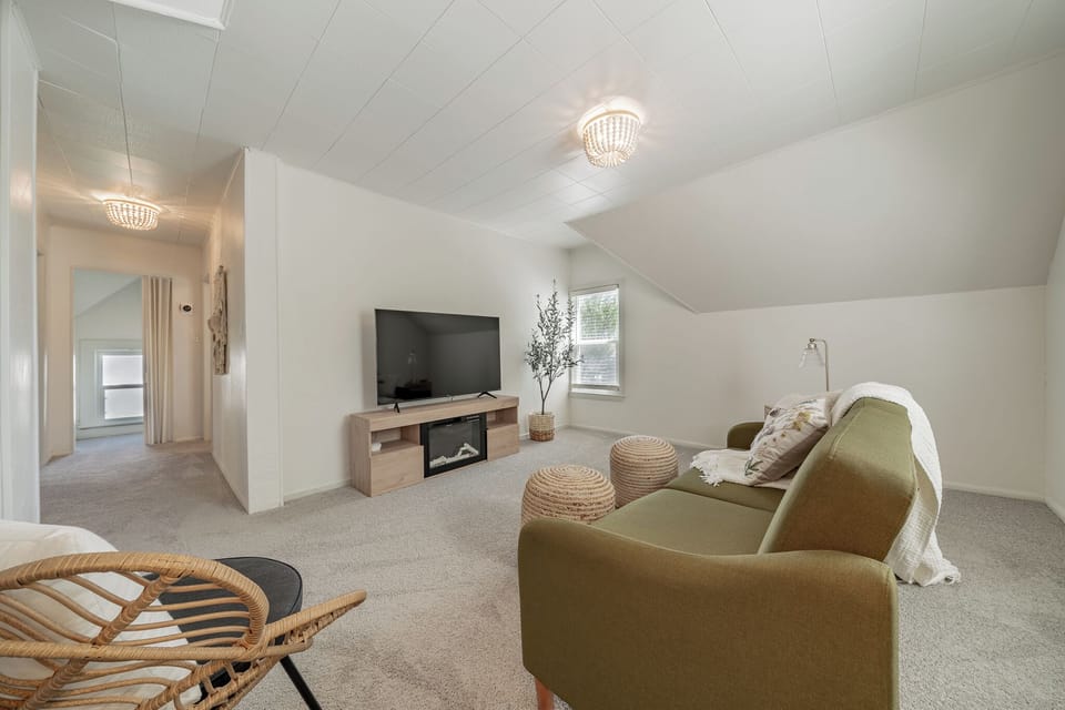 Light and airy living room with fold down couch for additional sleeping