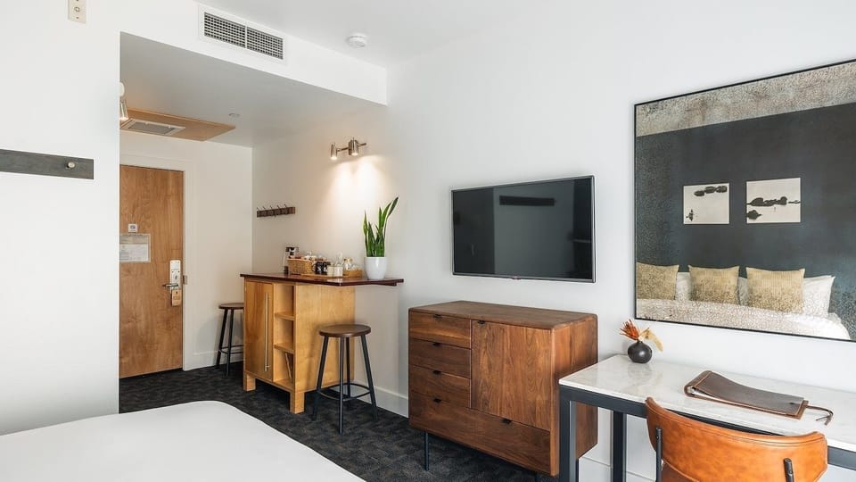 Enjoy a relaxed stay with TV comfort and nearby snacks.