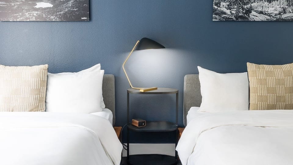 Wind down with warm bedside lighting and serene, restful styling.