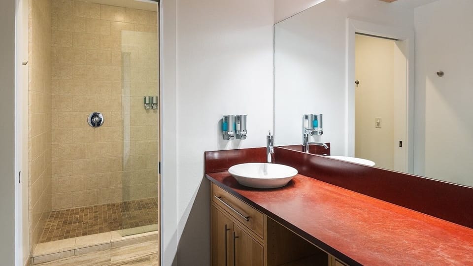 Refresh in the spacious walk-in shower and bright vanity.