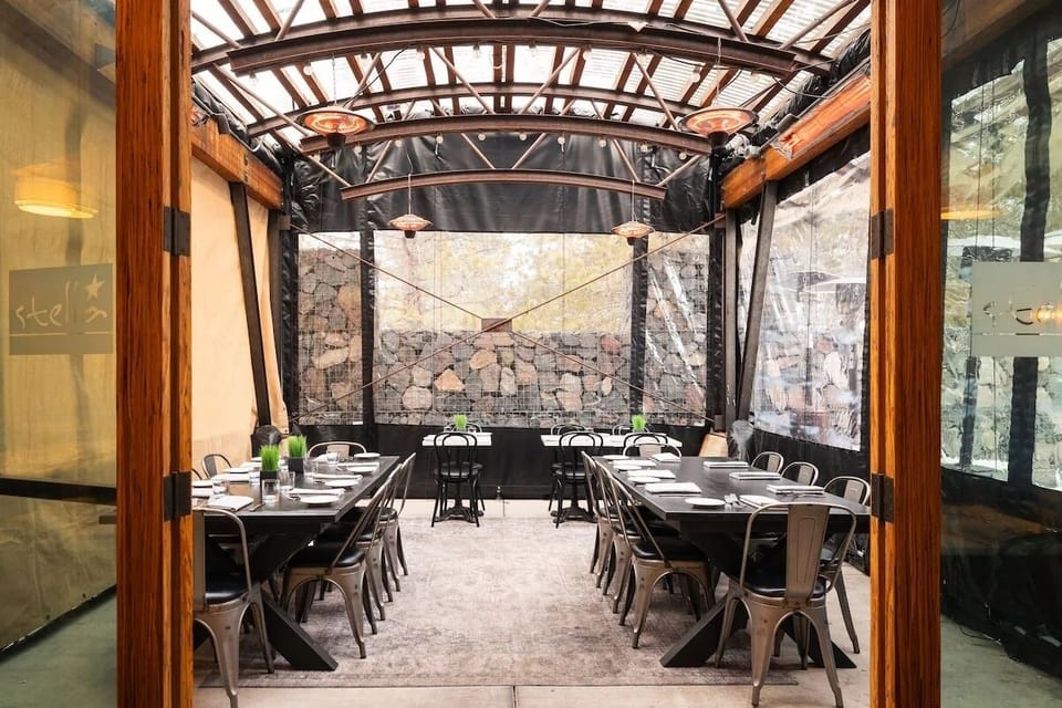 Toast long dinners under a bright, covered patio canopy.