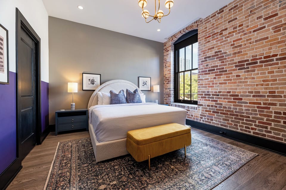Retreat to the Primary bedroom with a plush king bed, walk-in closet, blackout shades, and a smart TV. Designed for comfort and privacy, this suite is perfect for recharging after a day exploring New Orleans.
