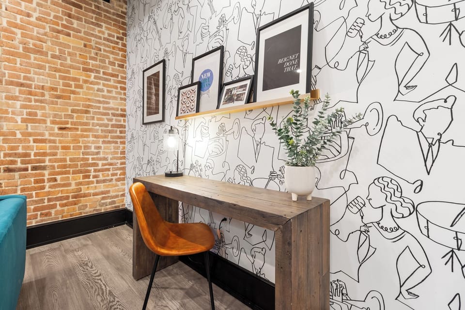 A cozy living room that blends comfort and productivity with a sleek workspace.