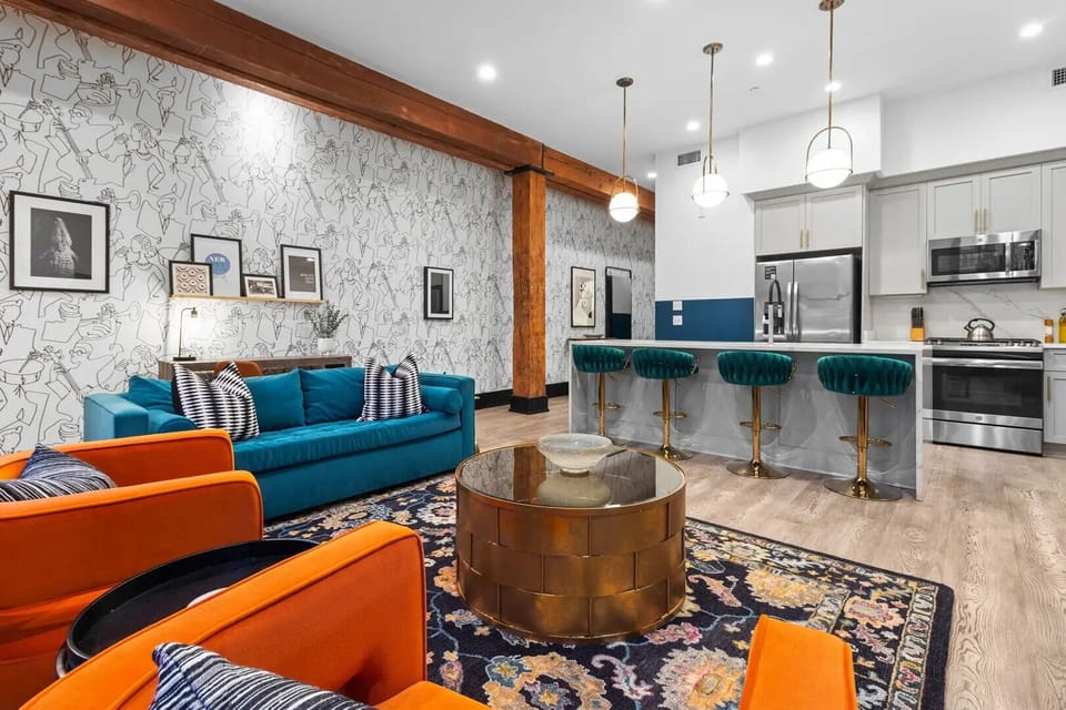 Relax in the living area with a smart TV, stylish seating, and a sleeper sofa for extra guests. Perfect for families or group stays in New Orleans, this inviting space is ideal for movie nights or recharging after a day in the city.