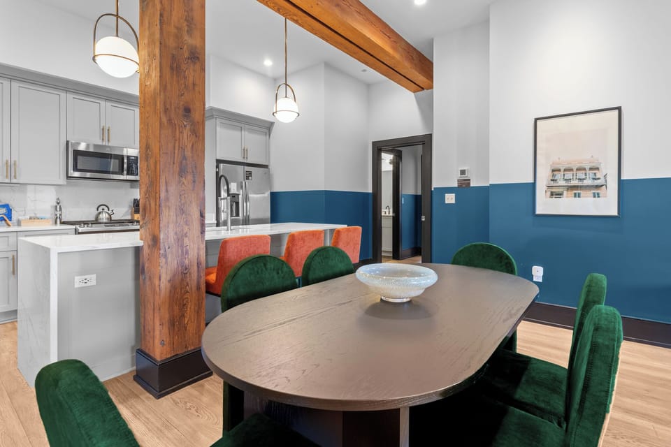 Enjoy meals together at your in-suite dining table with seating for your group. Whether it's takeout, delivery, or a home-cooked meal, this cozy dining area makes every stay at 888 Baronne feel like home in New Orleans.