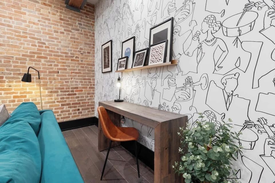 A cozy living room that blends comfort and productivity with a sleek workspace.