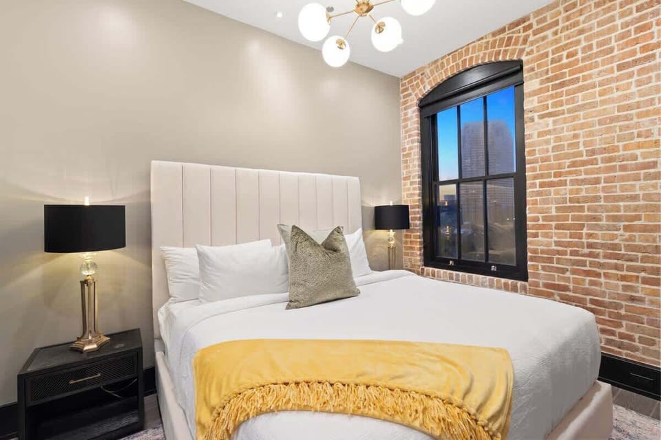 Retreat to the Primary bedroom with a plush king bed, walk-in closet, blackout shades, and a smart TV. Designed for comfort and privacy, this suite is perfect for recharging after a day exploring New Orleans.