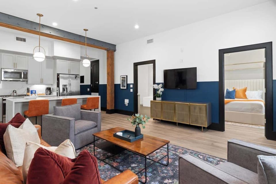 Relax in the living area with a smart TV, stylish seating, and a sleeper sofa for extra guests. Perfect for families or group stays in New Orleans, this inviting space is ideal for movie nights or recharging after a day in the city.