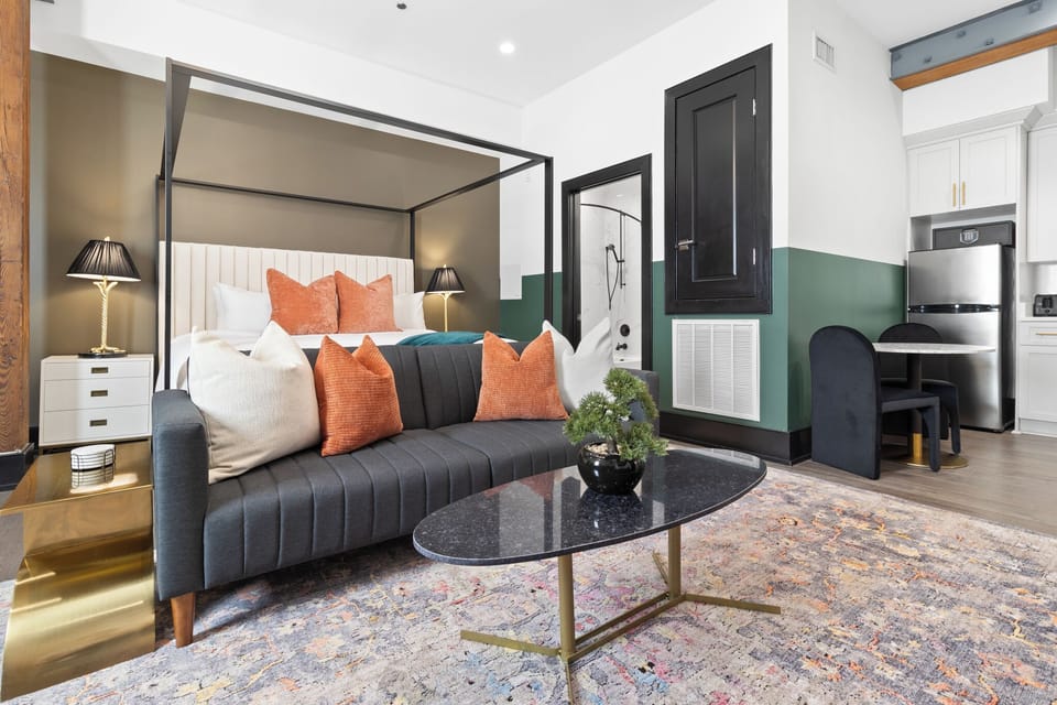 Relax in the living area with a smart TV, stylish seating, and a sleeper sofa for extra guests. Perfect for families or group stays in New Orleans, this inviting space is ideal for movie nights or recharging after a day in the city.