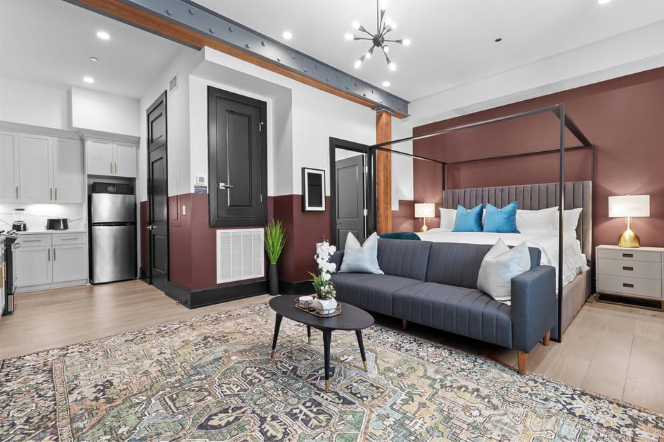 Relax in the living area with a smart TV, stylish seating, and a sleeper sofa for extra guests. Perfect for families or group stays in New Orleans, this inviting space is ideal for movie nights or recharging after a day in the city.