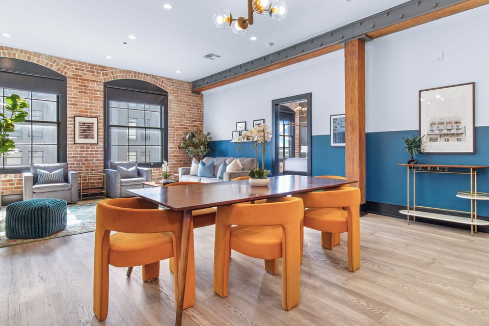 Enjoy meals together at your in-suite dining table with seating for your group. Whether it's takeout, delivery, or a home-cooked meal, this cozy dining area makes every stay at 888 Baronne feel like home in New Orleans.