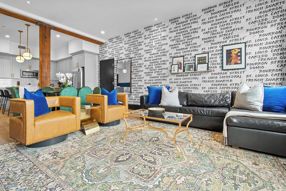 Relax in the living area with a smart TV, stylish seating, and a sleeper sofa for extra guests. Perfect for families or group stays in New Orleans, this inviting space is ideal for movie nights or recharging after a day in the city.