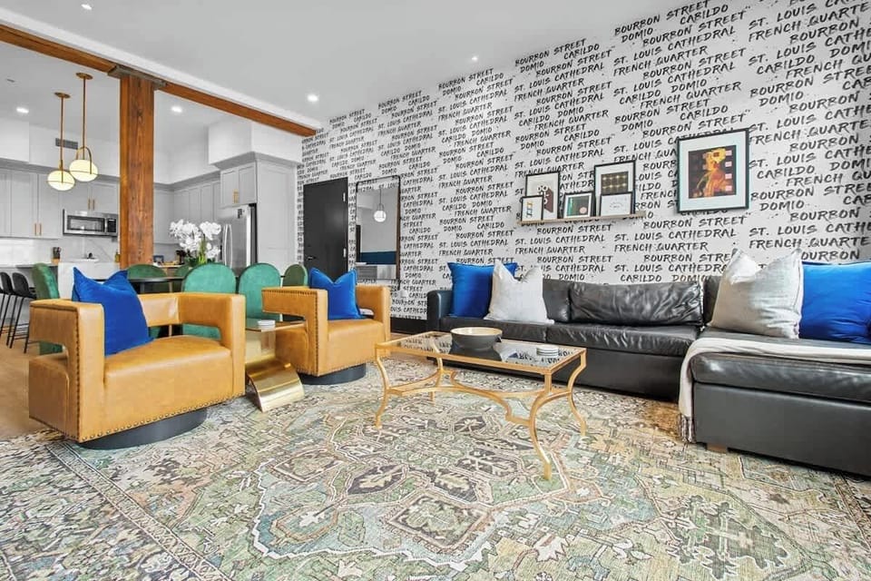 Relax in the living area with a smart TV, stylish seating, and a sleeper sofa for extra guests. Perfect for families or group stays in New Orleans, this inviting space is ideal for movie nights or recharging after a day in the city.