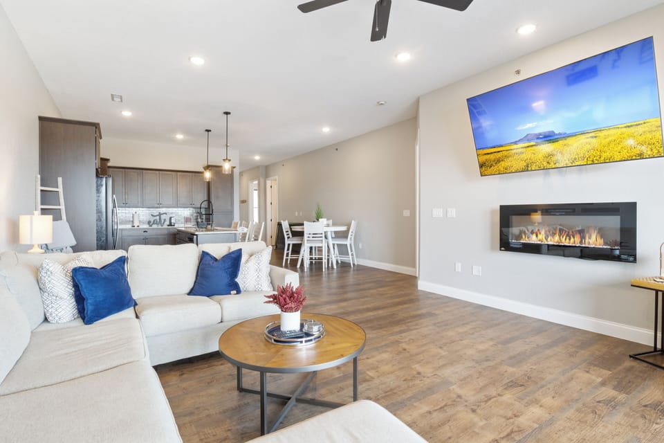 Spacious open-concept living area layout flows seamlessly into the modern kitchen and dining area, making it perfect for family gatherings or entertaining.
