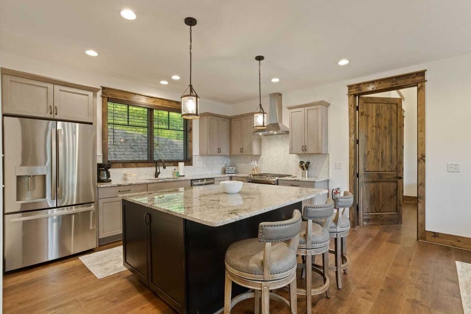 Spacious Kitchen with Granite Counters and Stainless Appliances