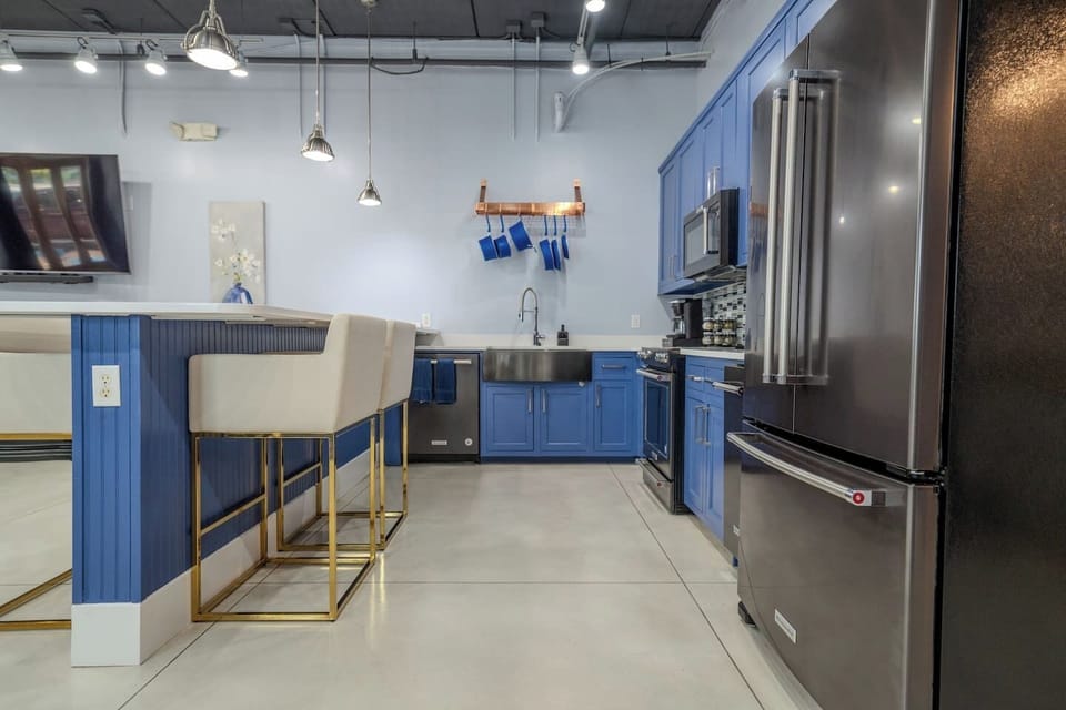 Beautifully updated kitchen with high end appliances, large island, and four barstools for dinning. Fully stocked with all basic cooking essentials provided. Has freestanding ice maker.