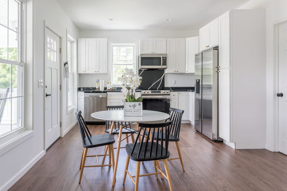 The private wing is complete with a living area, kitchen, full bathroom, deck, and two bedrooms.