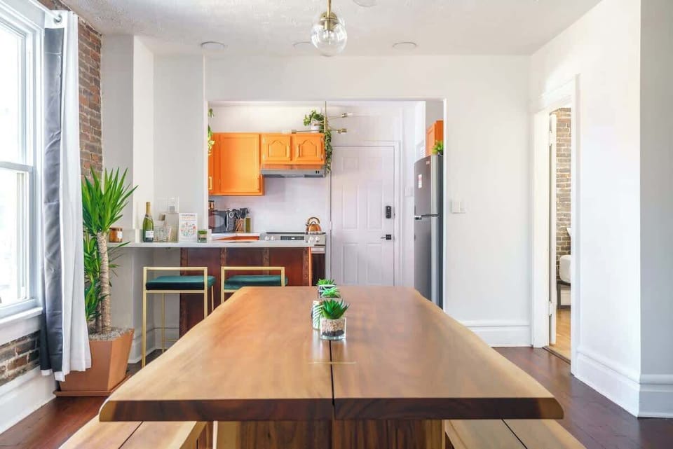 Our sleek and modern kitchen is perfect for both cooking and entertaining. The spacious dining table and stylish kitchen island create a sophisticated and functional space