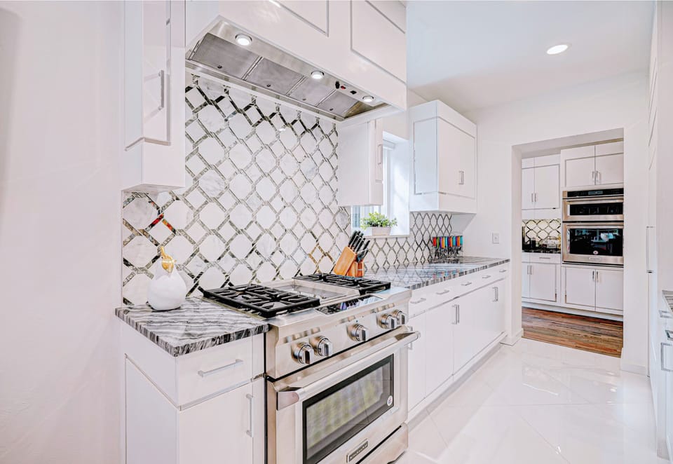 Modern appliances and sleek countertops create a chef-worthy kitchen in this rental.