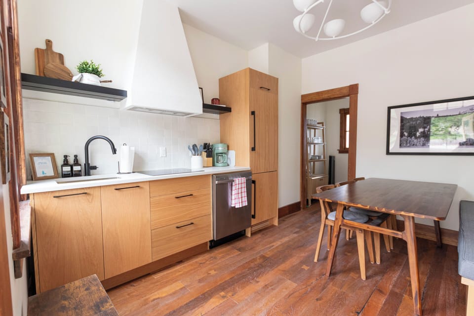 Cook and dine in a modern kitchen that perfectly balances rustic charm with contemporary style.