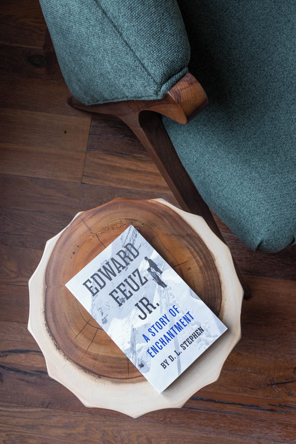 Nestle into this inviting chair with a captivating read that connects you to mountaineering adventures.