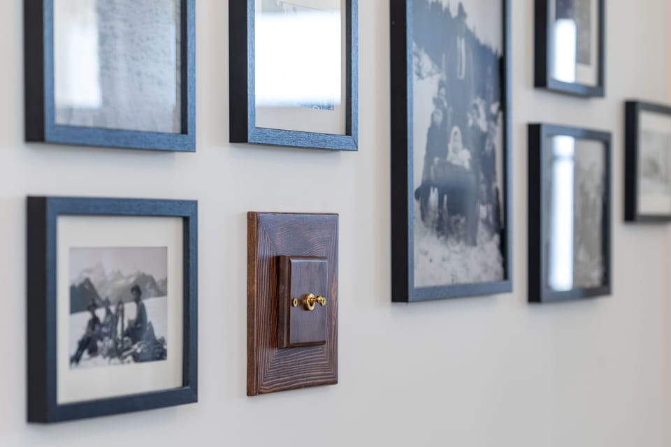 A glimpse into history with framed photos, showcasing moments from the golden era of mountaineering.
