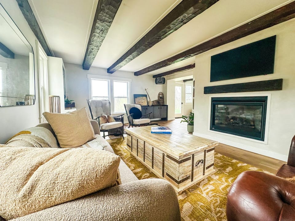 Living space has a smart Frame TV and a gas fireplace